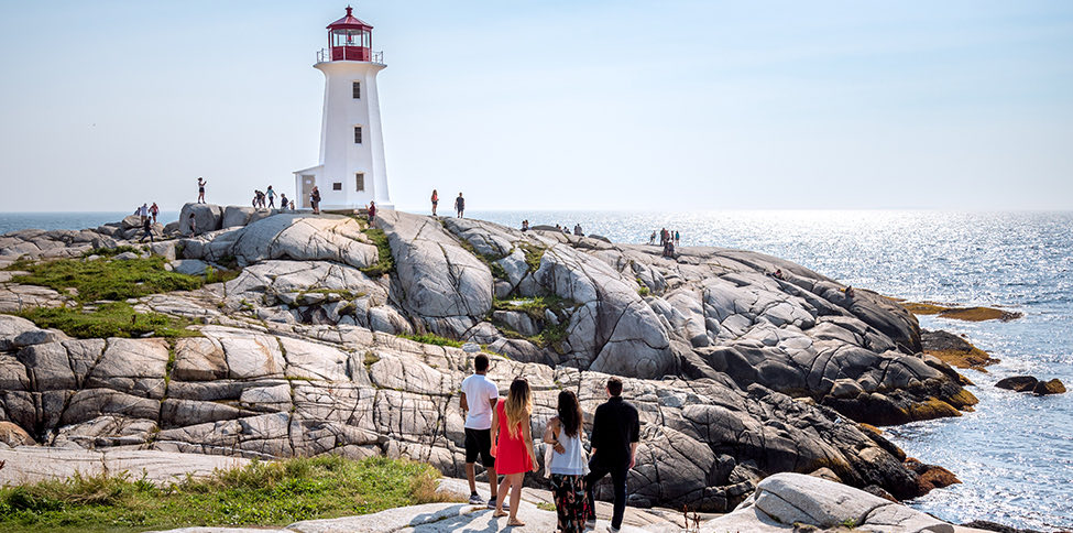 view of people walking around a lighthouse