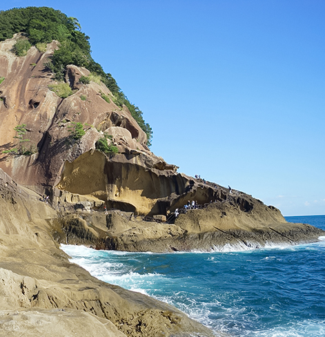 hiking trail within the cliff next to the ocean