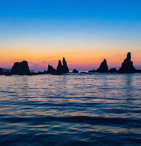 view of ocean with sunset in background