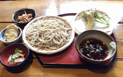 Cold soba noodles with a side of vegetable tempura and pickles