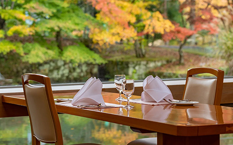 A table set with napkins and water glasses 