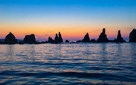 View of Hashigui Iwa rocks at sunset