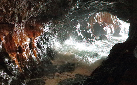 Water flowing through the Sandanbeki Cave in Wakayama