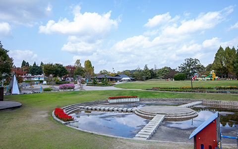 View of Kyoto Tamba Park with a fountain and playground