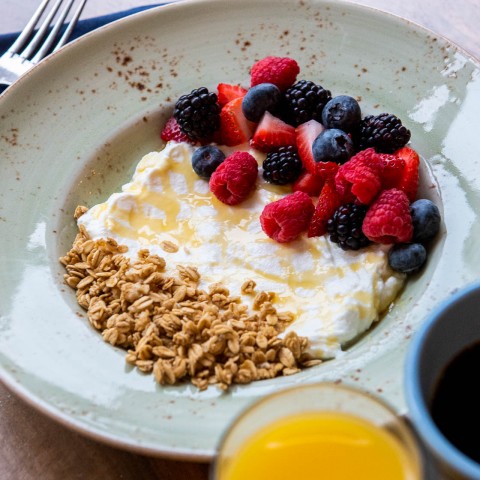 plate of yogurt, berrries and granola