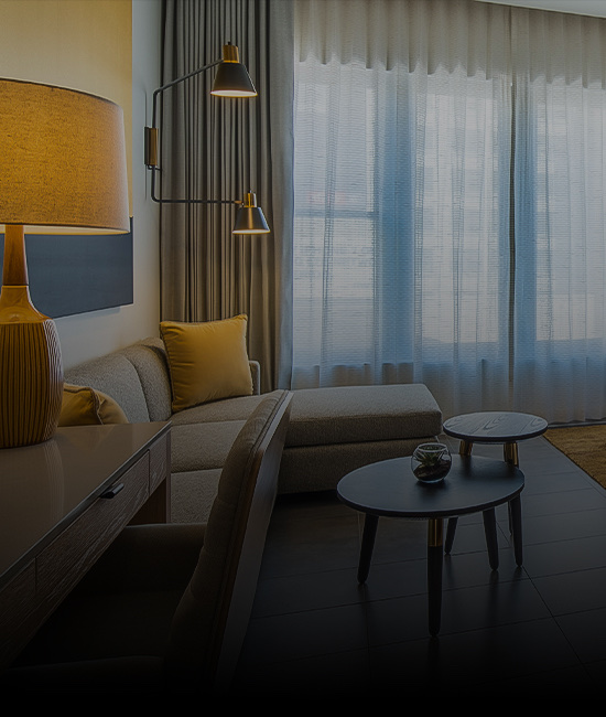 Living room with a couch and lamps