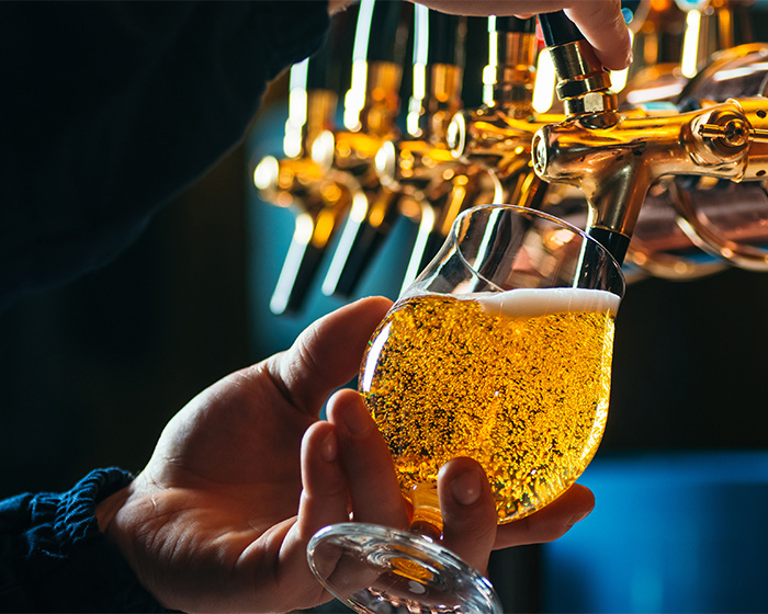 Man pouring beer into a glass