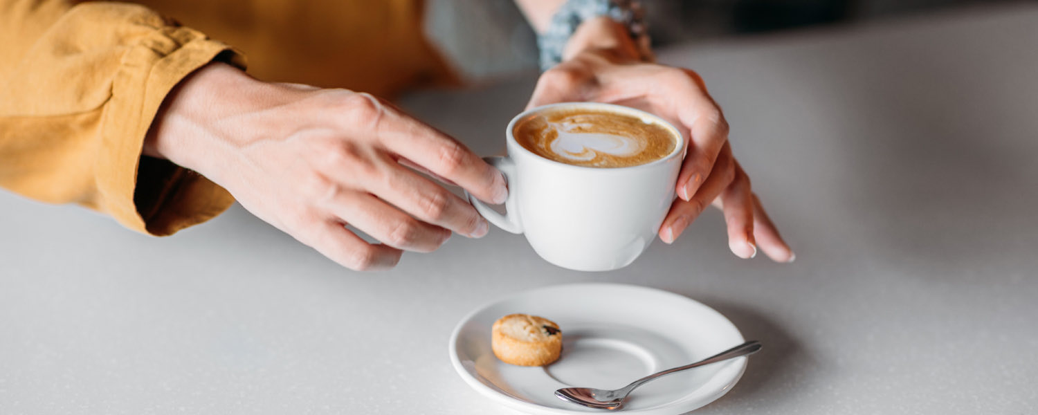 hands holding a mug of coffee