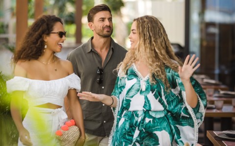 friends walking to their table at the restaurant