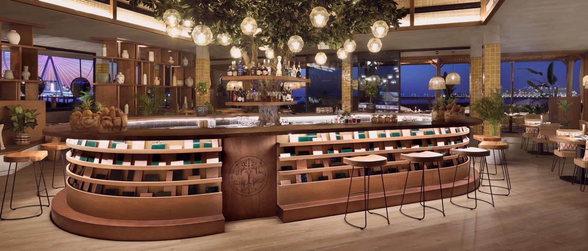 a bar with wooden features and a tree in the middle