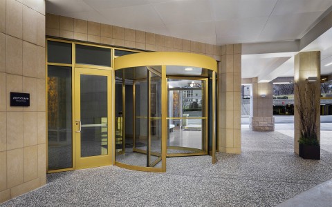 an entrance to a building with yellow trim around the doors