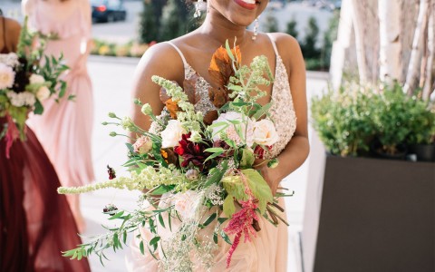 a woman holding a bouquet of flowers