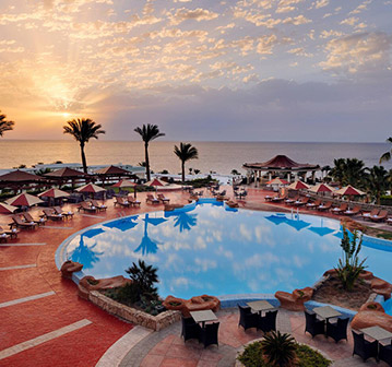 round crystalpool on Moroccan tropical shore with palm trees
