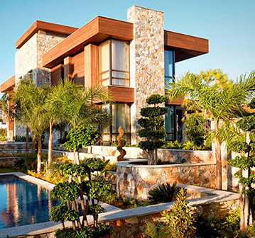 large brick building with beautiful landscaping